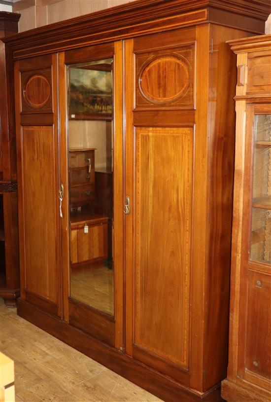 An Edwardian mahogany triple wardrobe W.184cm